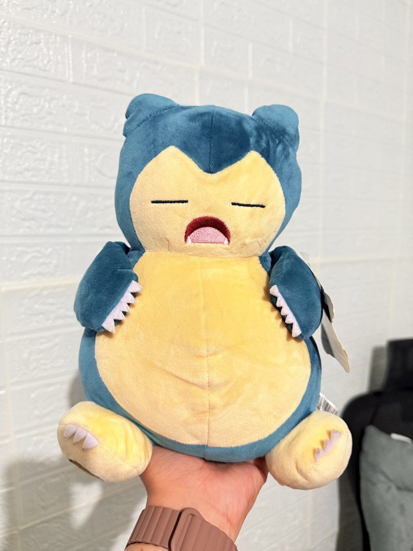 Pokémon Snorlax Plush Toy Soft (Category: Plushies & Soft Toys) located in Cavite. Submitted by projectplushie (Listing ID 1467264479, Image 1). Description: - Super soft fabric with a cute chubby belly and embroidered sleepy face - Sits upright easily on its own - Clean, flawless condition – perfect for gifts or collectors!.