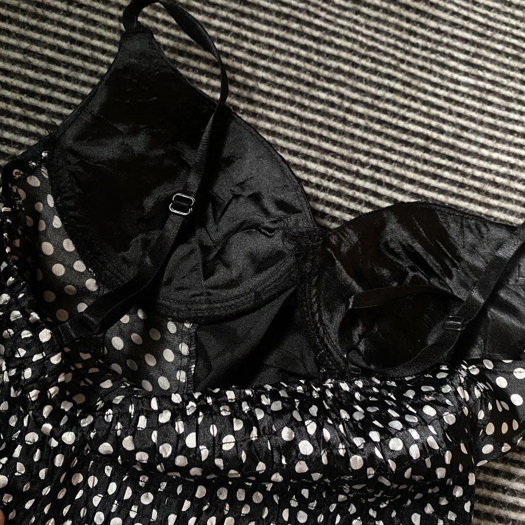 Polka Corset Top Lace Up (Category: Sleeveless) located in Manila. Submitted by isellgoodshi (Listing ID 1466817858, Image 3). Description: - Style: Black corset top with white polka dots - Support: Satin cups with underwire - Details: Ribbon lace-up front with black lace trim - Fit: Stretchy smocked back panel for comfort - Straps: Adjustable thin straps.