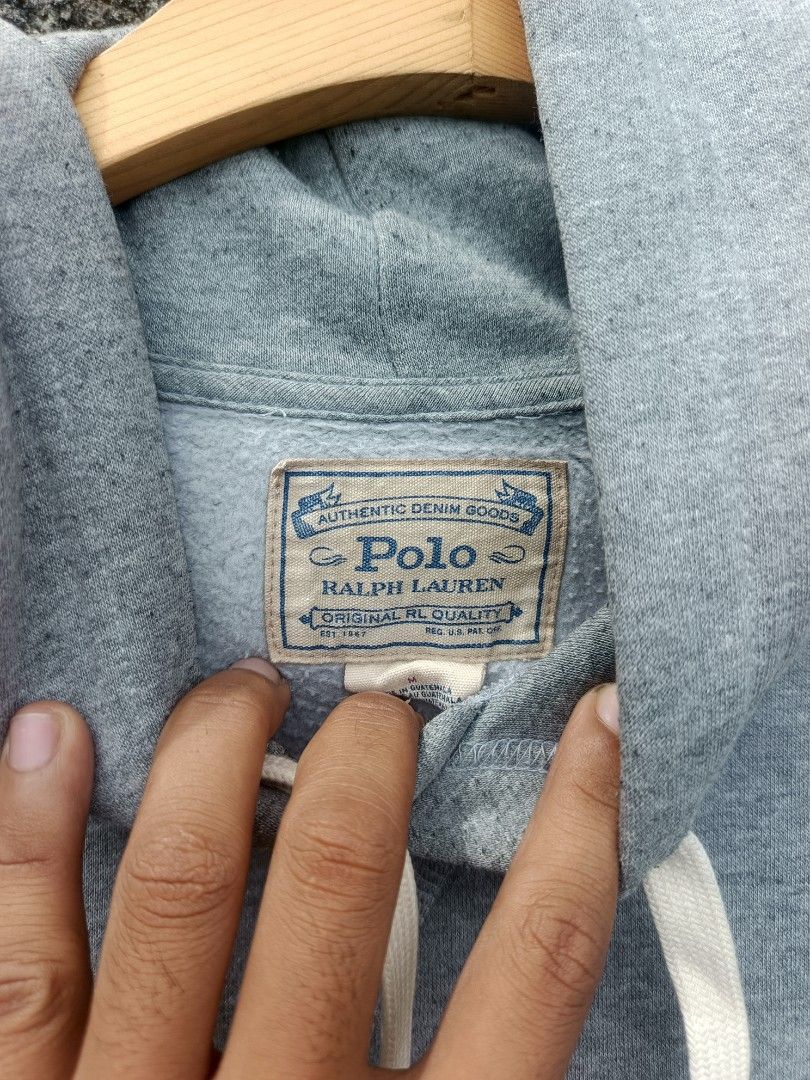 Polo Ralph Lauren Grey Hoodie Medium (Category: Coats, Jackets and Outerwear) located in Manila. Submitted by coyyimpothrift2 (Listing ID 1467217612, Image 2). Description: - Brand: Polo Ralph Lauren (Authentic Denim Goods line) - Color: Grey - Size: Medium - Logo: Signature embroidered pony on the chest - Features: Drawstring hood, front kangaroo pocket, ribbed cuffs - Material: Cotton and polyester blend with soft inner lining - Fit: Relaxed ev