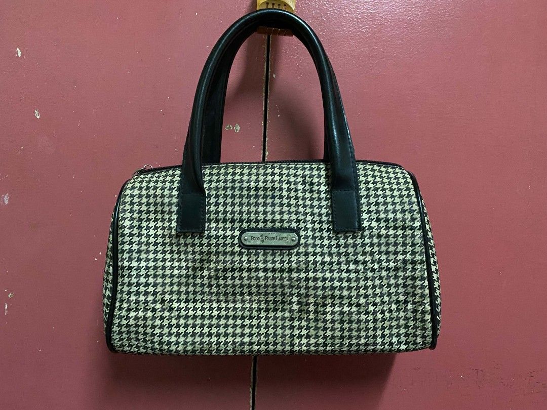 Polo Ralph Lauren Houndstooth Barrel Handbag Imitation (Category: Luxury Bags & Wallets) located in Paranaque City. Submitted by zackzero (Listing ID 1467228471, Image 1). Description: - Polo Ralph Lauren barrel bag IMITATION - Chic black and white houndstooth pattern with black leather handles and trim - Sleek silver-tone metal hardware and front brand plaque - Convenient exterior zip pocket on the back - Smooth-zippered main compartment with a 