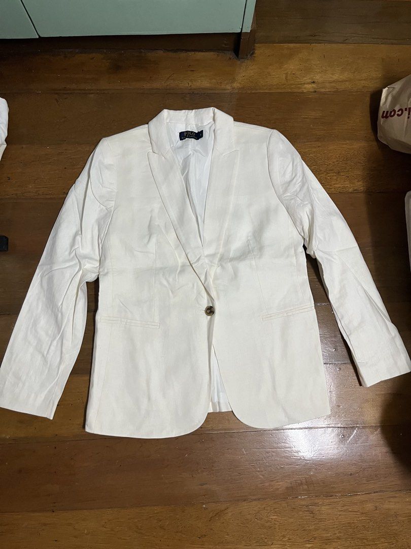 Polo Ralph Lauren White Blazer Size M (Category: Coats, Jackets and Outerwear) located in Mandaluyong City. Submitted by dadsmiddlechild (Listing ID 1467353525, Image 1). Description: - Brand: Polo Ralph Lauren - Color: Crisp White - Size: Medium (Tag attached at collar) - Closure: Single tortoiseshell-style button - Pockets: Two front jetted pockets - Details: Structured lapels and fully lined interior - Condition: Brand new with tags, clean fin