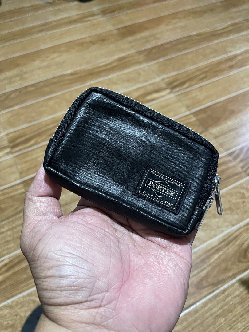 Porter Yoshida & Co Black Wallet (Category: Wallets & Card Holders) located in Mandaluyong City. Submitted by mark2pac (Listing ID 1467333896, Image 1). Description: - Brand: Porter Yoshida & Co. (Made in Japan) - Material: Premium black leather with durable fabric lining - Closure: Zip-around with sleek silver hardware - Interior: Multiple card slots for easy organization - Size: Compact design, fits easily in pockets or bags - Mode of Payment: 