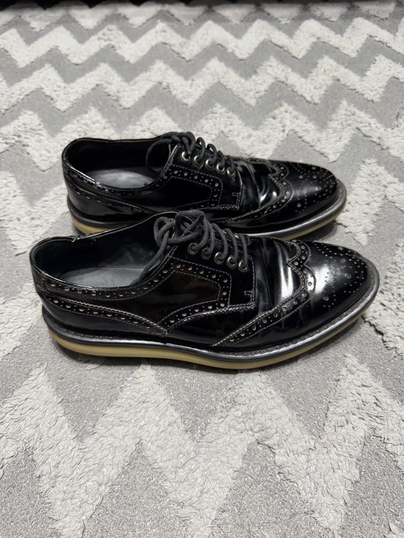 Prada - black Leather Wing tip shoes (Category: Casual Shoes) located in Cavite. Submitted by commoncourtesy (Listing ID 1467344218, Image 1). Description: Size 5 fits 7 mens.