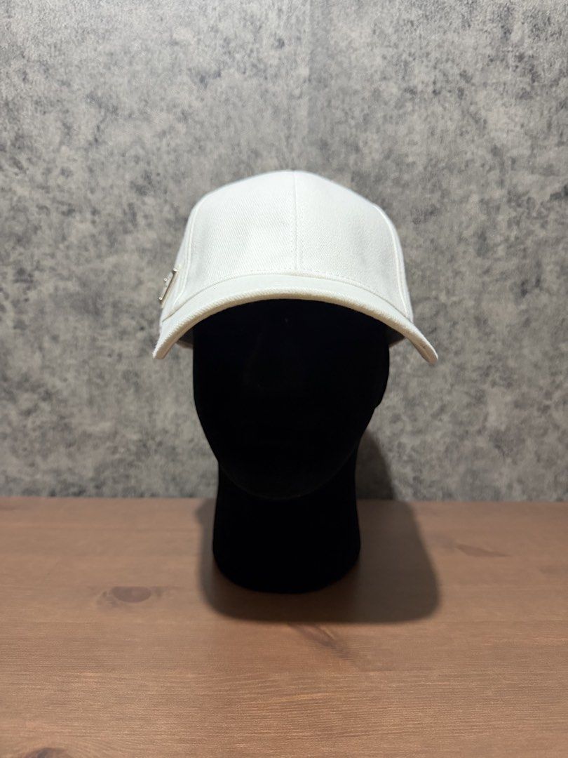 Prada - Side Triangle Logo White Cap (Category: Caps & Hats) located in Cavite. Submitted by commoncourtesy (Listing ID 1467322412, Image 1). Description: One size fits all.