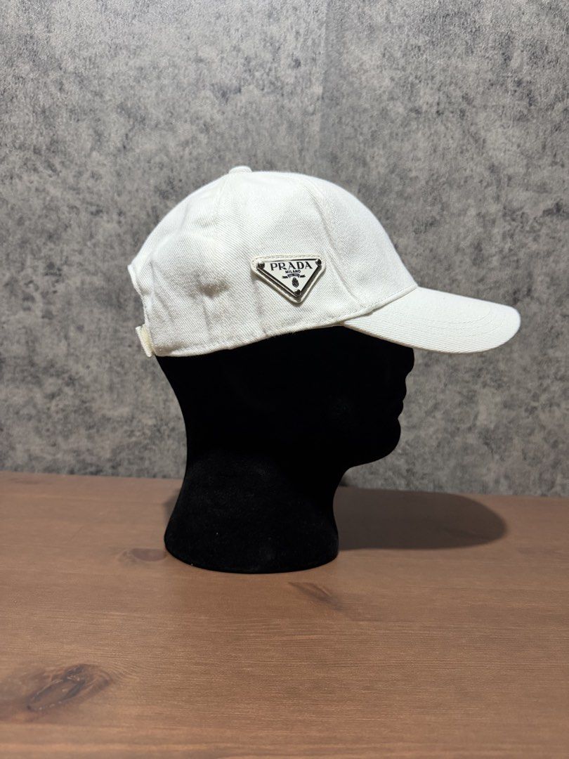Prada - Side Triangle Logo White Cap (Category: Caps & Hats) located in Cavite. Submitted by commoncourtesy (Listing ID 1467322412, Image 2). Description: One size fits all.