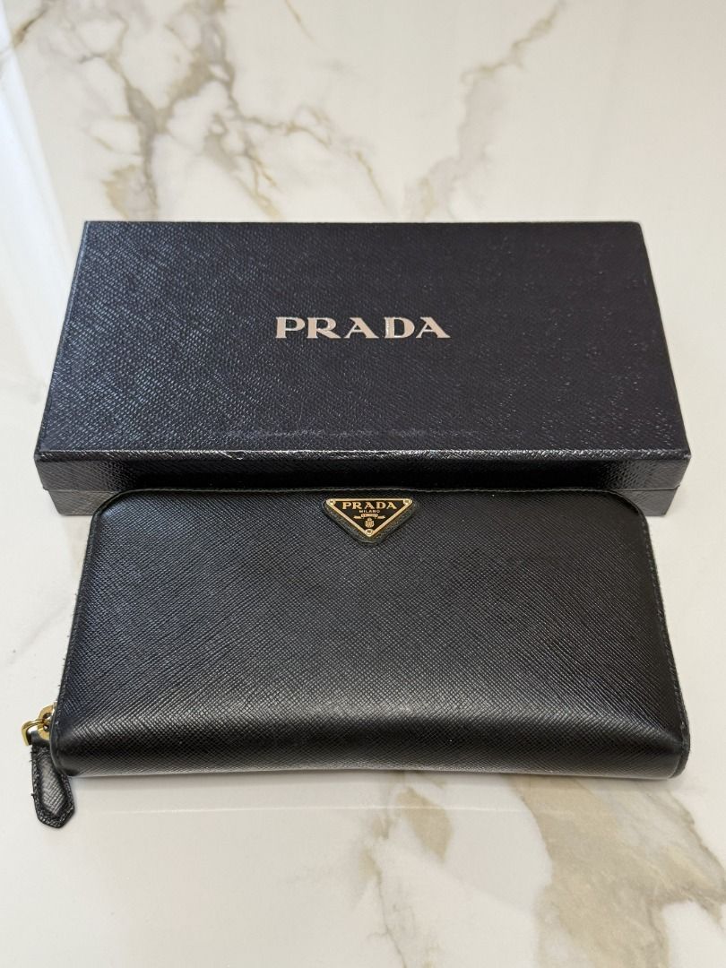 Prada Black Wallet (Category: Luxury Bags & Wallets) located in Marikina City. Submitted by tashdeclutters. (Listing ID 1467314935, Image 1). Description: ✨ Prada Black Wallet - P15,990 ✨ Condition: 3 - Good/Lightly Used 🛍️ Purchased in: Japan ✨ @tashdeclutters ✨ Created to share the things that no longer spark joy with Tash — and hopefully, let them spark joy for someone else. 🤍 📌 SHOP POLICIES • Prices posted are FINAL. • NO LOWBALLERS. If y