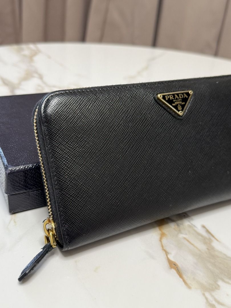 Prada Black Wallet (Category: Luxury Bags & Wallets) located in Marikina City. Submitted by tashdeclutters. (Listing ID 1467314935, Image 2). Description: ✨ Prada Black Wallet - P15,990 ✨ Condition: 3 - Good/Lightly Used 🛍️ Purchased in: Japan ✨ @tashdeclutters ✨ Created to share the things that no longer spark joy with Tash — and hopefully, let them spark joy for someone else. 🤍 📌 SHOP POLICIES • Prices posted are FINAL. • NO LOWBALLERS. If y