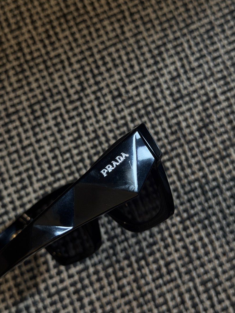 Prada SPR A06 Black Sunglasses (Category: Sunglasses & Eyewear) located in Pasay City. Submitted by leosolleza (Listing ID 1467195674, Image 2). Description: orig: 12.5k (on sale) rfs: funds; not bring used used thrice only box, cloth, sunnies.