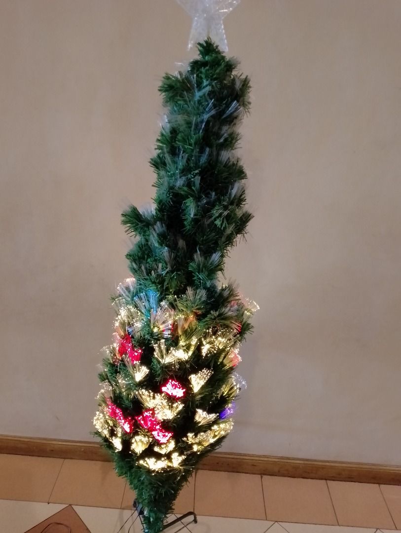Pre-lit fibre optic Christmas tree with decorations (Category: Artificial Plants & Flowers) located in Manila. Submitted by delosoryan29536 (Listing ID 1467239554, Image 2). Description: - Fibre optic Christmas tree with multi-coloured lights - Includes star topper and sturdy metal stand - Comes with bonus decorations: baubles, mini wreaths, stockings, and tree skirt - Tested and working perfectly - Quick and easy holiday setup.
