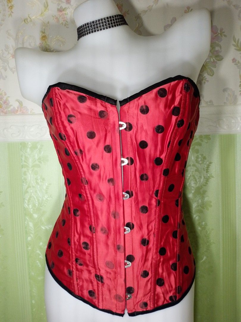 Preloved Polka Magnetic Corset Top (Category: Others Tops) located in Dasmarinas. Submitted by ms.happycorsets (Listing ID 1467308517, Image 1). Description: Preloved Magnetic Corset Top Black and Red Color Can Fit Large size to Large size Starting waistline 32-36 inches length 15 1/2 inches Not Stretchable Fabric Has Lace tie adjustable at the back Has 12 Soft bones With Slight flaws has faded polka velvet black dots on some parts Actual Photo C