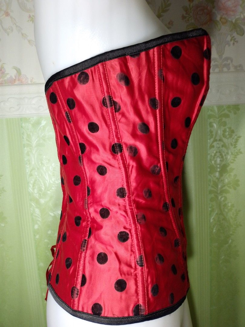 Preloved Polka Magnetic Corset Top (Category: Others Tops) located in Dasmarinas. Submitted by ms.happycorsets (Listing ID 1467308517, Image 3). Description: Preloved Magnetic Corset Top Black and Red Color Can Fit Large size to Large size Starting waistline 32-36 inches length 15 1/2 inches Not Stretchable Fabric Has Lace tie adjustable at the back Has 12 Soft bones With Slight flaws has faded polka velvet black dots on some parts Actual Photo C