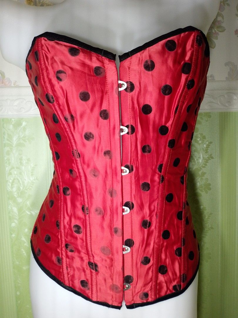 Preloved Polka Magnetic Corset Top (Category: Others Tops) located in Dasmarinas. Submitted by ms.happycorsets (Listing ID 1467308517, Image 2). Description: Preloved Magnetic Corset Top Black and Red Color Can Fit Large size to Large size Starting waistline 32-36 inches length 15 1/2 inches Not Stretchable Fabric Has Lace tie adjustable at the back Has 12 Soft bones With Slight flaws has faded polka velvet black dots on some parts Actual Photo C