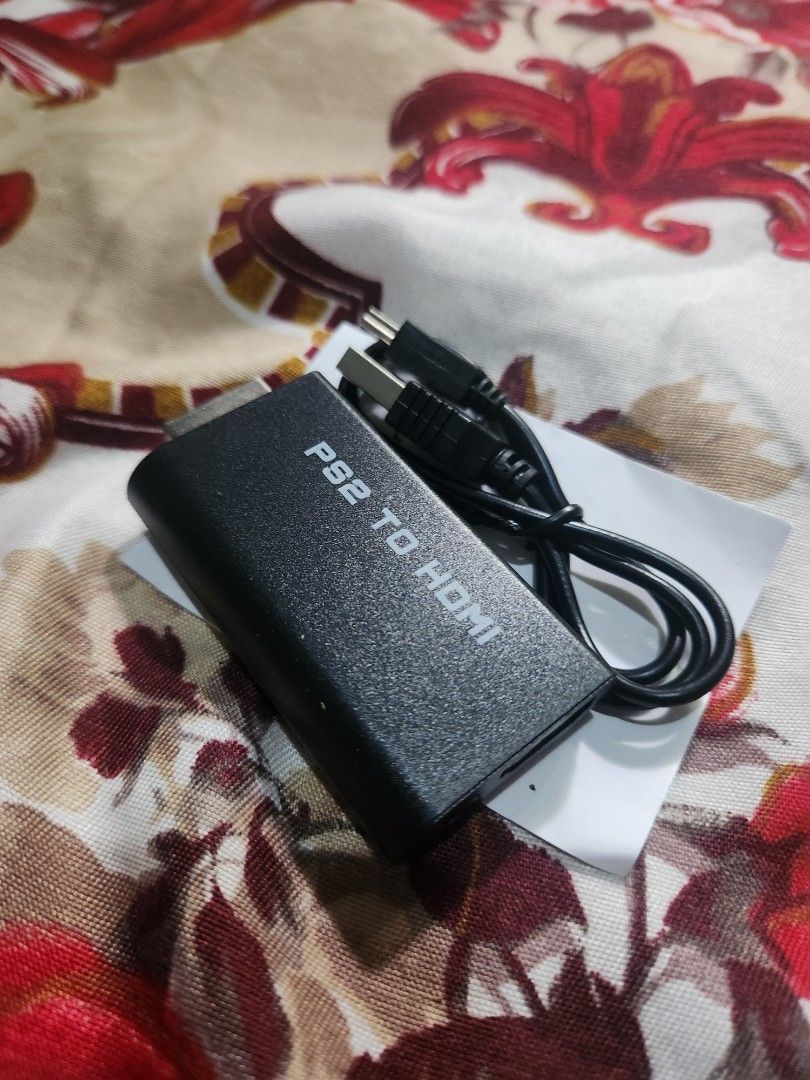 PS2 to HDMI Converter Adapter with USB Cable (Category: Cables & Adaptors) located in Caloocan City. Submitted by jayrevidizo (Listing ID 1467222730, Image 1). Description: - Color: Black - Compatibility: Connects PS2 consoles to modern TVs and monitors with HDMI - Easy Setup: Simple plug-and-play operation - Inclusions: Includes power cable and manual (found underneath packaging) - Condition: Brand new and ready to use.