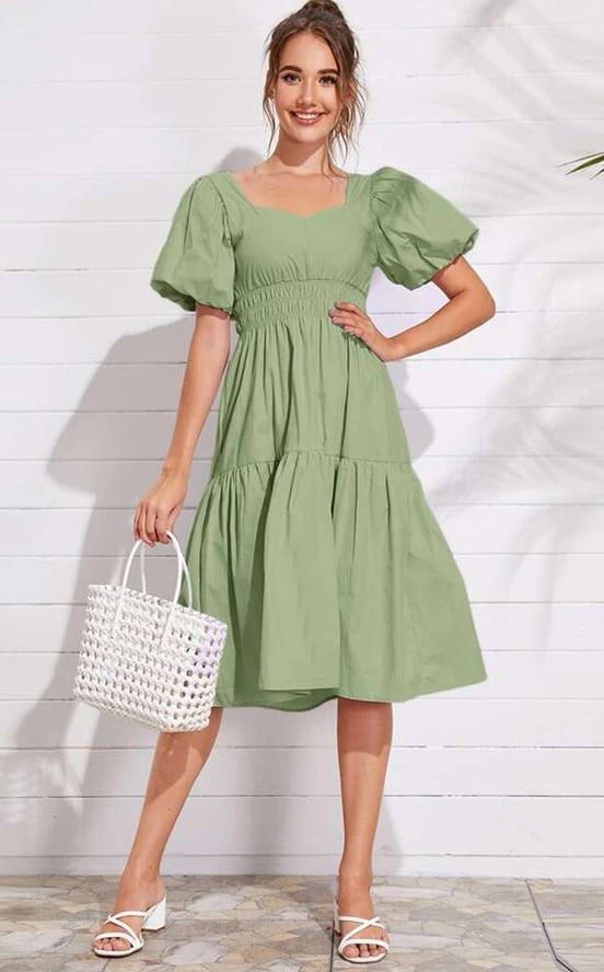 Puff Sleeve Dress (Category: Dresses) located in Manila. Submitted by dechlotter_ (Listing ID 1467299347, Image 1). Description: - Color: Sage green - Style: Midi dress with tiered flared skirt falling below the knees - Neckline & Sleeves: Square neckline with short puff sleeves - Fabric: Lightweight and easy to style - Occasion: Perfect for casual outings or weekend wear - Condition: Clean, no flaws found.