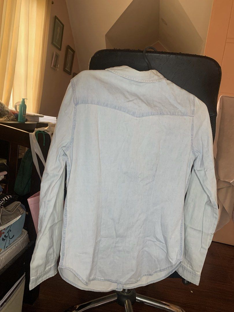 Pull&Bear Light Blue Denim Shirt Size S (Category: Shirts) located in Santa Rosa. Submitted by annydeclutters (Listing ID 1467206003, Image 2). Description: - Brand: Pull&Bear - Item: Denim shirt in light blue wash - Size: S - Details: Button-down front, classic collar, two chest pockets, and button cuffs - Condition: Pre-owned with a couple of small, faint stains near the pocket and shoulder area (kindly check photos closely before buying).
