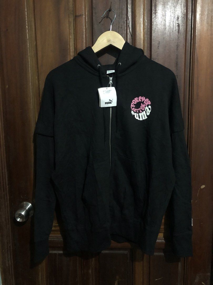 Puma Forever Better Black Zip-Up Hoodie (Category: Coats, Jackets and Outerwear) located in Quezon City. Submitted by yeahsource222 (Listing ID 1467242152, Image 1). Description: Black full-zip hoodie from Puma. Features 'Forever Better Puma' graphic circular print on front chest and large on the back. Drawstring hood, front kangaroo pocket, ribbed cuffs and hem. Style number 531602-01. Original store tags still attached. Never worn..