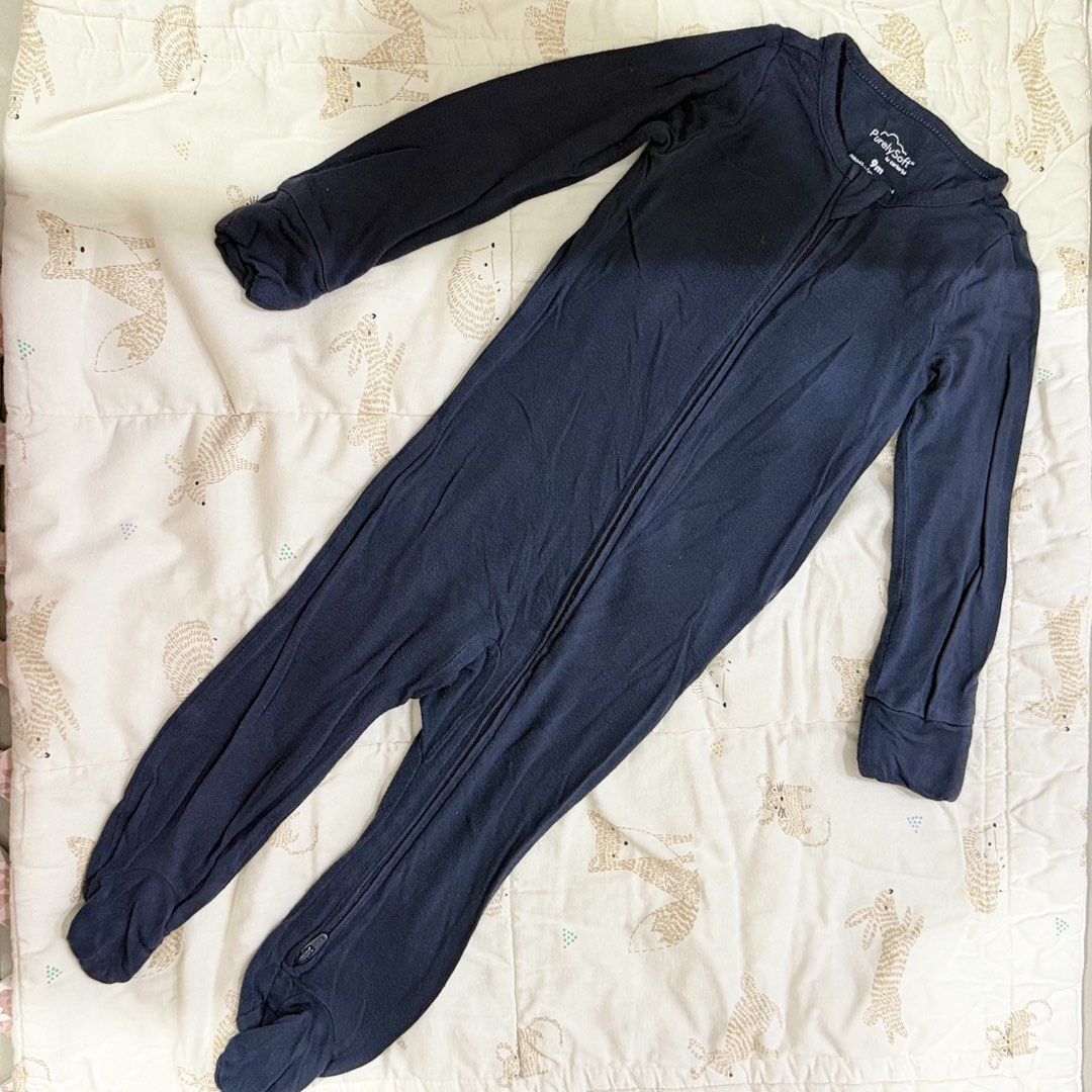 PurelySoft by Carter's Navy Blue Footed Sleeper 9 Months (Category: Babies & Kids Fashion) located in Paranaque City. Submitted by yuffie__ (Listing ID 1467188092, Image 1). Description: - Brand/Maker: PurelySoft by Carter's - Size: 9 Months - Color: Classic Navy Blue - Material: Soft, stretchy modal blend - Design: Long sleeves with built-in footies to keep baby warm - Feature: Practical 2-way front zipper for hassle-free diaper changes.