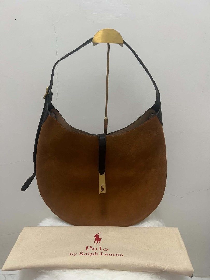 Ralph Lauren Polo Suede Shoulder Bag (Category: Shoulder Bags) located in Paoay. Submitted by rvf1230 (Listing ID 1467317951, Image 2). Description: - Brand: Polo Ralph Lauren - Material: Rich brown suede with dark leather trim - Strap: Adjustable dark leather strap - Closure & Details: Front flap strap with gold-toned logo plaque - Interior: Roomy with one zippered pocket and slip pockets - Inclusion: Original dust bag included - Condition: Exce