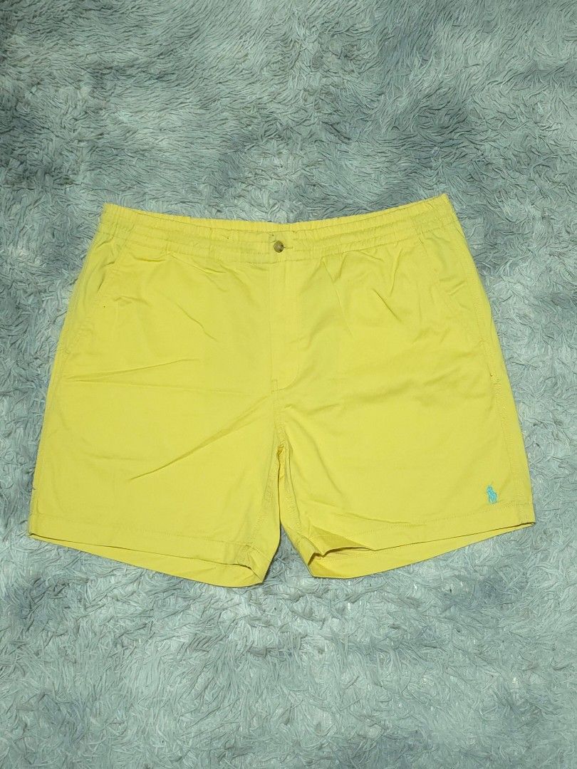 Ralph Lauren Yellow Shorts (Category: Shorts) located in Abulug. Submitted by humanwhosellthings (Listing ID 1467256450, Image 1). Description: - Brand: Ralph Lauren -Size 38-42W x 17L - Color: Bright yellow with light blue embroidered pony logo - Pockets: Convenient side pockets and back buttoned pockets - Waistband: Elastic waistband for a comfortable fit - Condition: Clean fabric, no stains or damage spotted - Style: Great for casual sunny day