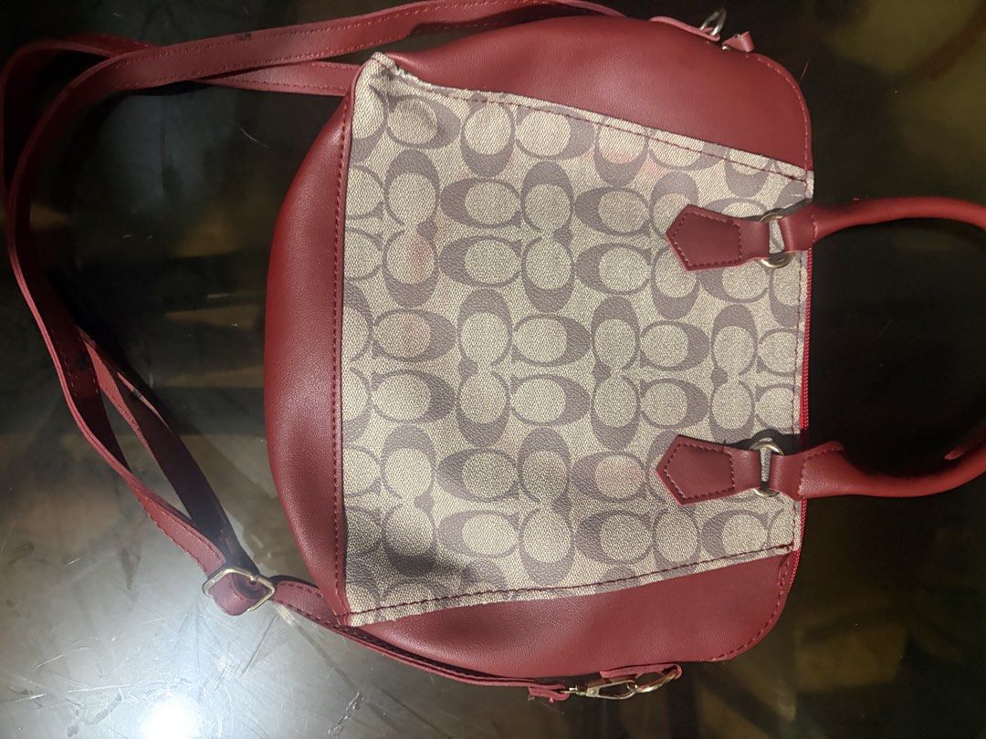 Red and Beige Monogram Crossbody Handbag (Category: Cross-body Bags) located in Manila. Submitted by mcllts (Listing ID 1467349111, Image 2). Description: - Design: Red and beige monogram pattern with striking red faux leather trim - Carry options: Sturdy top handles and a convenient adjustable shoulder strap - Closure: Secure top zipper closure - Condition note: Interior black lining shows significant wear, peeling, and marks (priced to clear) -