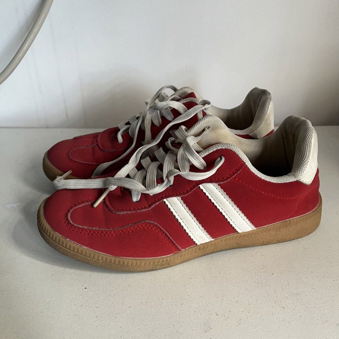 Red Corolla Shoes (Category: Sneakers) located in Caloocan City. Submitted by iamqwertyy (Listing ID 1467176218, Image 3). Description: - Size: 37 - Color/Design: Red suede with white stripes, white heel tab, and red script logo - Soles: Classic gum rubber - Condition: Uppers are in solid shape; shows light wear on the inner lining and laces - Style: Comfortable low-profile skate or casual walking sneakers.