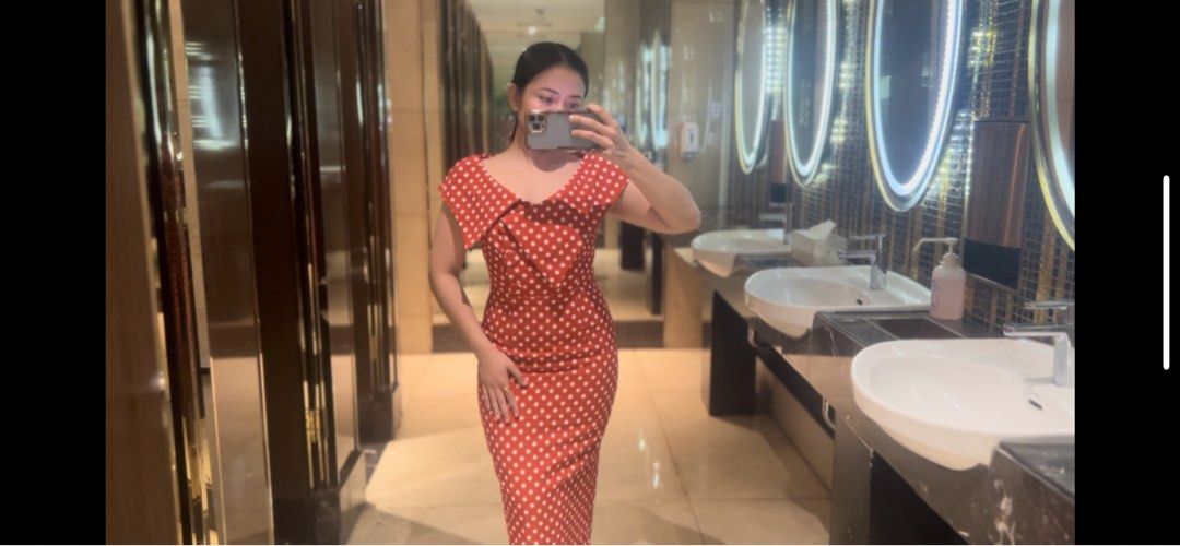 Red Polka Dot Midi Dress (Category: Dresses) located in Makati City. Submitted by warm.abc123 (Listing ID 1467271307, Image 2). Description: - Color & Pattern: Red with all-over white polka dots - Style: Fitted silhouette with cap sleeves and folded neckline collar - Feature: Back slit at the hem for easy and comfortable movement - Condition: Worn once, freshly washed, and well-maintained - Occasion: Ideal for lunch outings, dates, and casual eve