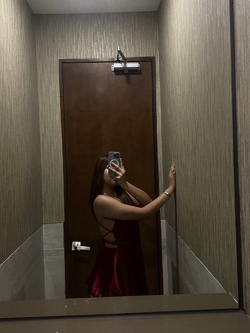 Red Satin Mini Dress Backless Cowl Neck (Category: Dresses) located in Manila. Submitted by renkacoleni (Listing ID 1467221860, Image 3). Description: - Color: Deep red - Material: Smooth, shiny satin with slight stretch - Design: Cowl neckline, thin spaghetti straps, and open back with crisscross straps - Skirt: Flared, layered mini hem - Condition: Worn once, still in great shape - Perfect for: Night outs, parties, and special events.