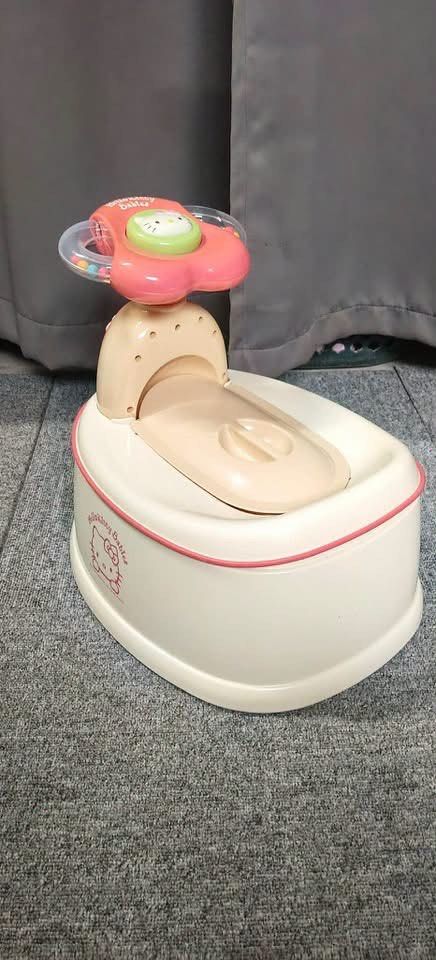 Richell Hello Kitty Potty Trainer Japan Import (Category: Toilet Training) located in Manila. Submitted by janetecson05 (Listing ID 1467198657, Image 3). Description: - Authentic Richell brand Kitty potty training set imported from Japan - Complete set: pink training base, handle attachment with rattle beads, and plush pink seat cover - Includes original box and instruction manual in plastic - Multi-stage design grows with your toddler - Clean co