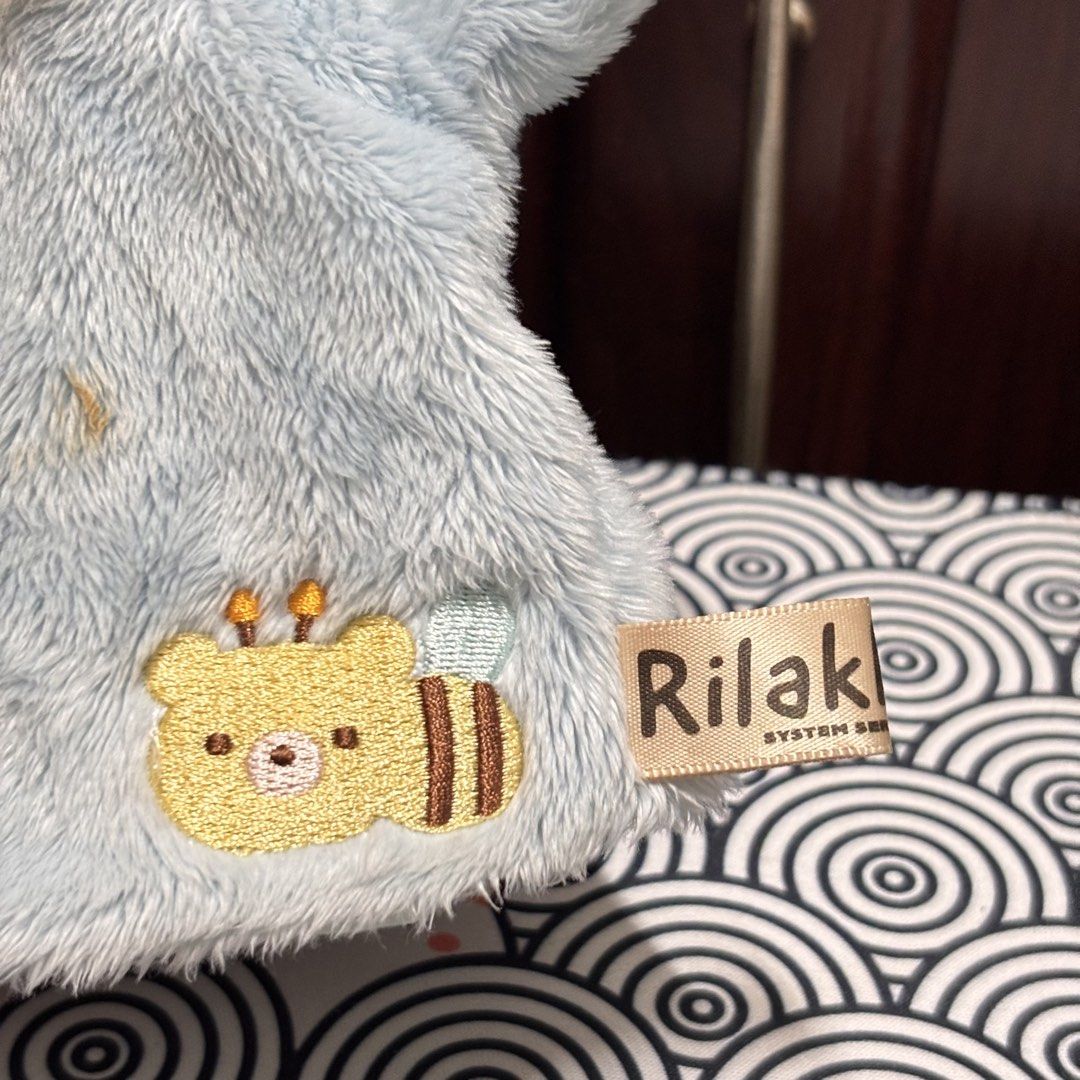 Rilakkuma Blue (Category: Plushies & Soft Toys) located in Manila. Submitted by nero.ph (Listing ID 1467323024, Image 3). Description: - Authentic San-X Rilakkuma system series plush hand puppet in light blue - Super soft and fluffy material with adorable white belly detail and tiny fangs - Features a cute embroidered bee character near the bottom hem - Official 'Rilakkuma' tag attached on the side - Perfect toy for storytelling, playtime, or add