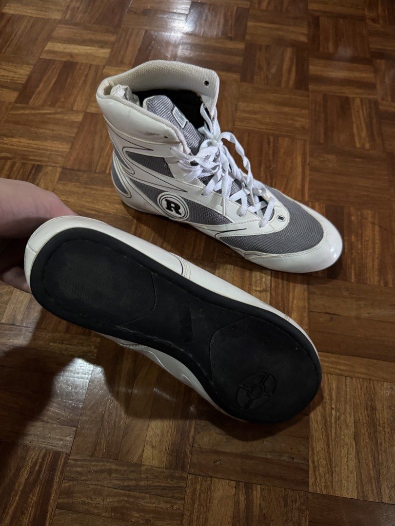 Ring Side Boxing Shoes White Grey US 11 (Category: Sneakers) located in Manila. Submitted by seangoart (Listing ID 1467174974, Image 3). Description: - Brand/Model: Ring Side Boxing Shoes - Color: White and Grey - Size: US 11 / EUR 45 1/3 - Design: High-top with lace-up closure and breathable mesh panels - Outsole: Durable rubber for canvas traction - Condition: Minor scuffs and marks on upper and soles from previous gym use - Perfect for trainin
