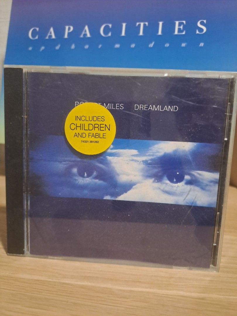 Robert Miles Dreamland Audio CD Album (Category: CDs & DVDs) located in Las Pinas. Submitted by cobieshop (Listing ID 1467327669, Image 1). Description: - Artist & Album: Robert Miles - Dreamland Audio CD - Hits Included: Features iconic tracks like 'Children' and 'Fable' - Special Feature: Original yellow hype sticker on the front cover - Condition: Disc plays perfectly; standard jewel case has minor surface scuffs from storage - Ideal For: Elec