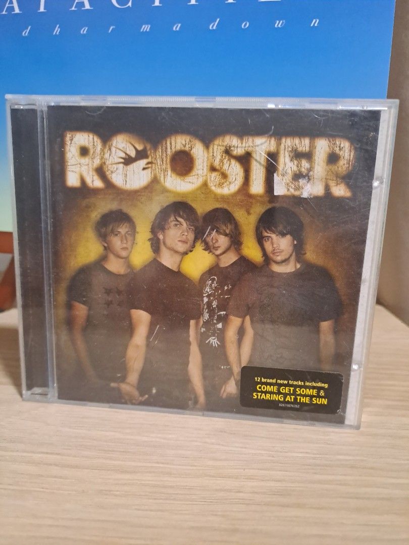 Rooster Self-Titled Album Audio CD (Category: CDs & DVDs) located in Las Pinas. Submitted by cobieshop (Listing ID 1467327542, Image 1). Description: - Artist/Album: Rooster (Self-Titled) - Format: Audio CD in standard jewel case - Hit Tracks: Includes 'Come Get Some' and 'Staring at the Sun' - Hype Sticker: Original sticker on the front cover - Condition: Jewel case has minor surface scuffs from storage; disc plays great.