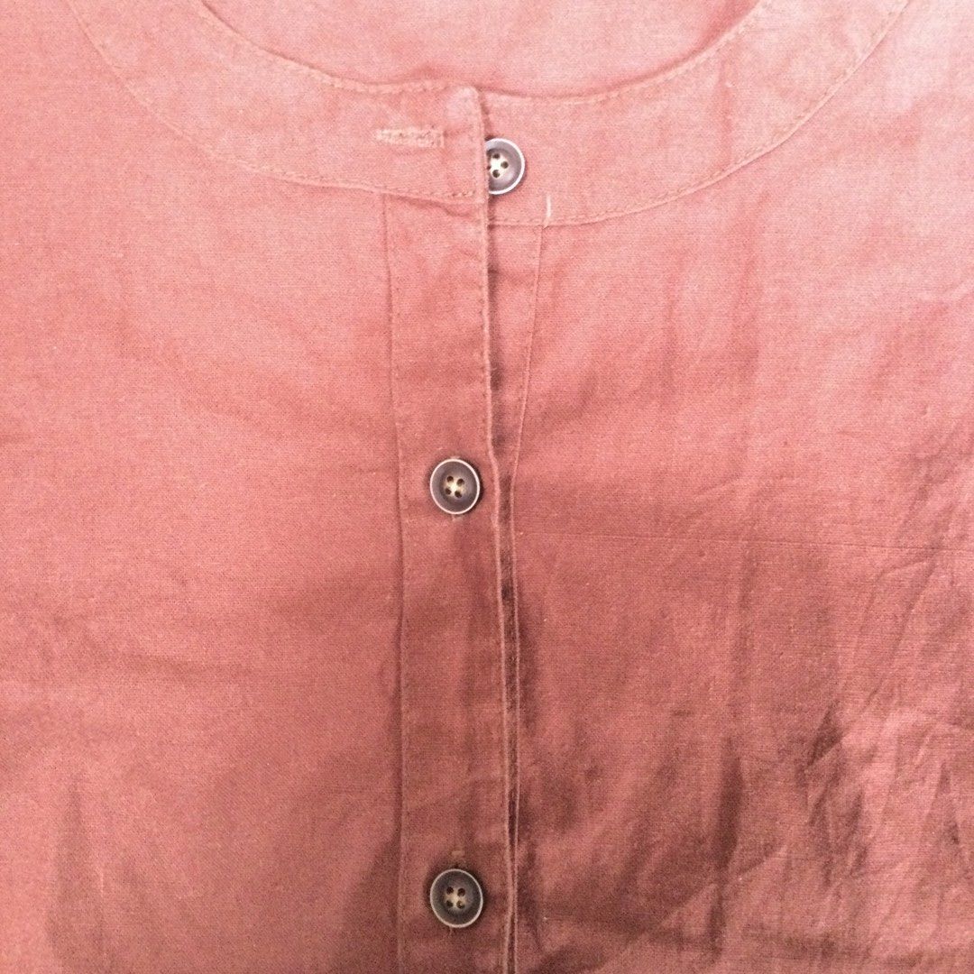 Rust / Terracotta Short-Sleeve Knotted Hem Blouse (Category: Blouses) located in Binangonan. Submitted by ininnep (Listing ID 1467327313, Image 3). Description: ✅ Brand XMET 👕 Item Rust / Terracotta Short-Sleeve Knotted Hem Blouse 📝 Details • Color: Warm rust / burnt orange / terracotta • Neckline: Round collarless neck (band collar style) • Closure: Button-front placket with 5 dark round buttons • Hem: Cute twisted/knot detail at front — creat