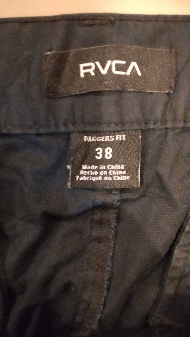 RVCA Daggers Fit Black Pants Size 38 (Category: Jeans) located in Angeles City. Submitted by mightywhale_13072f (Listing ID 1467284303, Image 3). Description: - Brand: RVCA - Model: Daggers Fit Pants - Color: Black - Size: 38 Waist.Lenght 42. - Material: 79% cotton, 17% nylon, 4% elastane (with stretch) - Closure: Standard button and zip fly - Special Detail: Zippered back pocket on the right with RVCA logo branding - Condition: Excellent / Ready