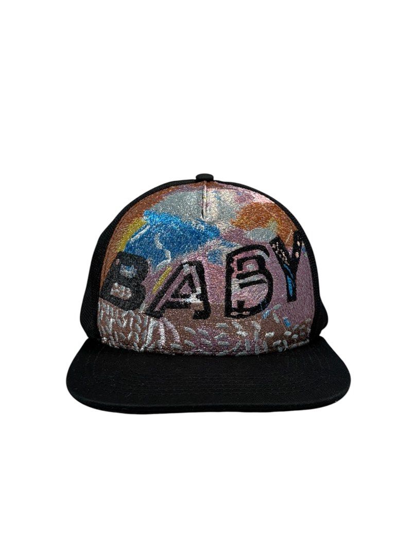 Saint Laurent 2016 Metallic "Baby" Hat (Category: Luxury Accessories) located in Cagayan de Oro. Submitted by thatsdopethrift (Listing ID 1467277416, Image 1). Description: Saint Laurent Paris metallic “Baby” trucker cap from Hedi Slimane’s iconic Spring/Summer 2016 “Surf Sound” runway collection. A highly sought-after archival piece reflecting Hedi Slimane’s signature California-rock aesthetic, perfect for high-end streetwear collectors and SLP 