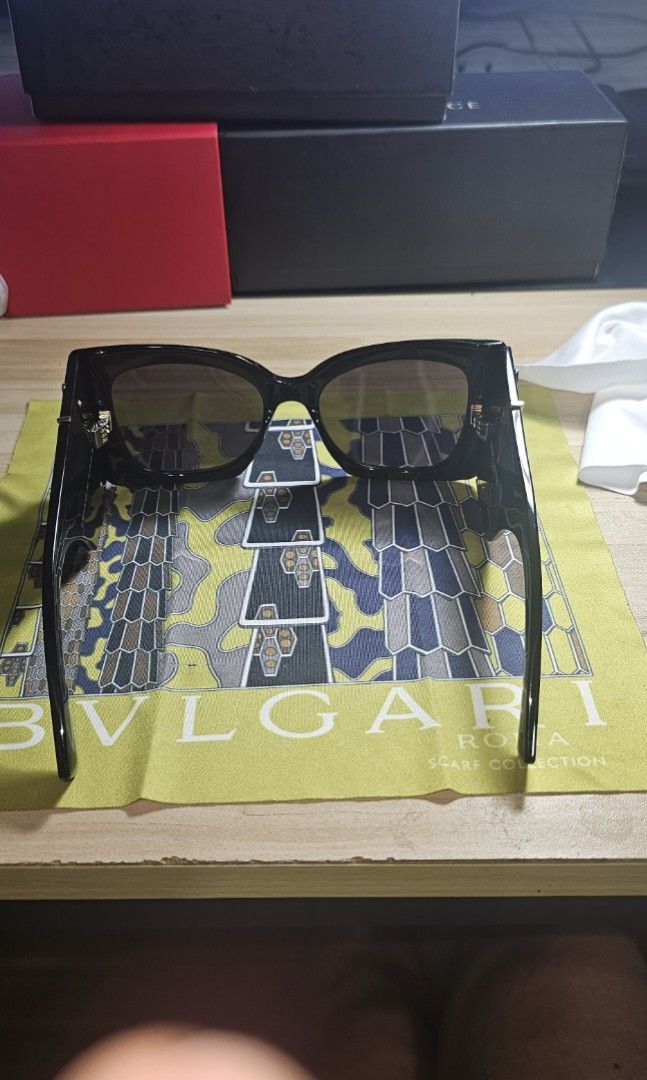 Saint Laurent Sunglasses with YSL Monogram Black (Category: Sunglasses & Eyewear) located in Manila. Submitted by anthonylee23810 (Listing ID 1466449749, Image 3). Description: Black frames with dark tinted lenses. Gold YSL monogram logo on the temples. Thick arm design. Includes a Dolce & Gabbana box and dust pouch. Box shows minor wear. Clean lenses and frames overall. Ready to wear..