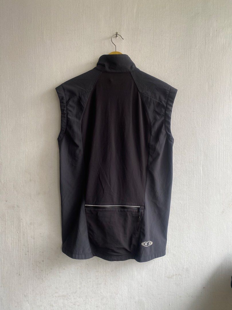 Salomon ClimaWind Black Athletic Vest (Category: Vests) located in Manila. Submitted by anthony1723 (Listing ID 1467193962, Image 2). Description: - Brand: Salomon - Style: ClimaWind Athletic Vest - Color: Dark grey with contrast side panels - Closure: Full zip front with stand-up collar - Pockets: Convenient zipper pockets on lower front and back - Branding: Salomon logo printed on left chest and back hem - Condition: Excellent, highly-rated sel