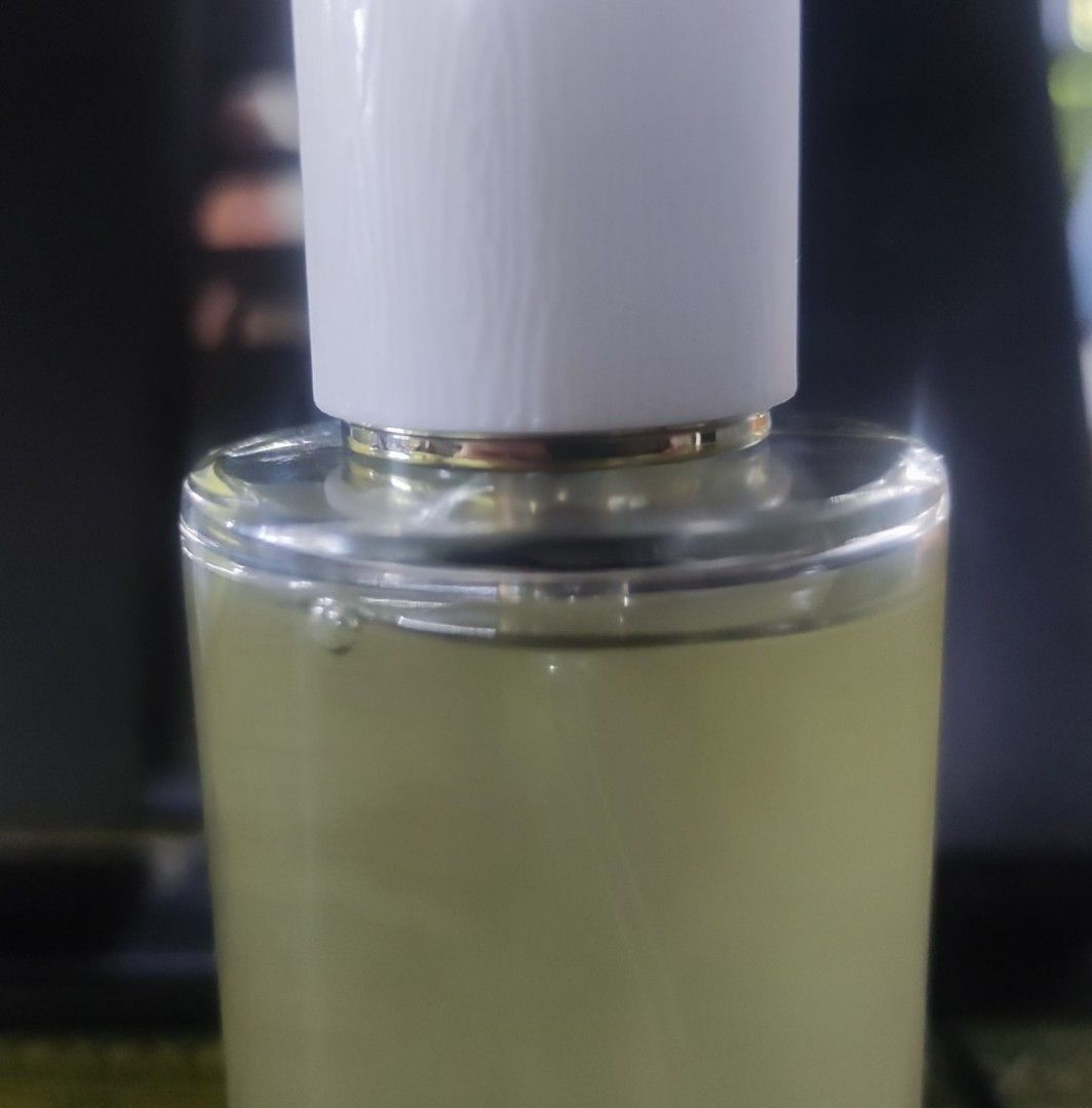Sancto Perfume - Supreme King (Category: Fragrance & Deodorants) located in Iloilo. Submitted by danec. (Listing ID 1467213291, Image 2). Description: - Brand: Sancto fragrance - Design: Features One Piece Gear 5 Luffy artwork wrap - Bottle: Clear glass with white cap and gold-tone collar - Liquid: Pale yellow tint with spray nozzle - Condition: Good remaining volume.