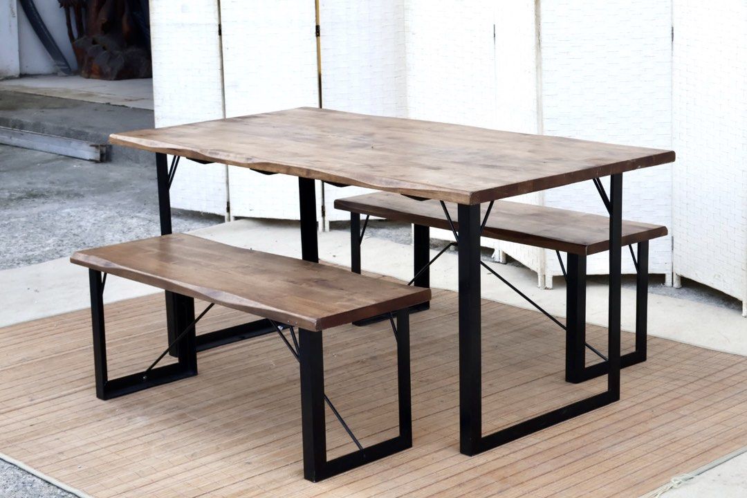Sanka Japan Reno Dining Table with Two Benches (Category: Tables & Sets) located in Bulacan. Submitted by FurnitureGallery (Listing ID 1467310481, Image 2). Description: - Style: Industrial dining set (1 table + 2 matching benches) - Materials: Solid wood top with natural grain/oil finish and sturdy black iron legs - Features: Metal framing with diagonal support bars for extra stability JAPAN SURPLUS FURNITURE "Sankan Japan" HEAVY SOLID WOOD SLAB