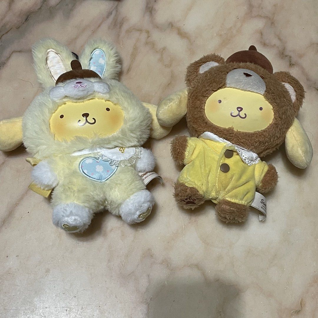 Sanrio Pompompurin Plush Toy Set (Category: Plushies & Soft Toys) located in Las Pinas. Submitted by chocolemon (Listing ID 1467175111, Image 1). Description: - Set of 2 Pompompurin plushies in adorable animal costumes - Bunny costume features fluffy hat and blue heart details - Bear costume features front button accents - Original tags still attached - Made with super soft, high-quality material - Imported from overseas and kept in pristine stor