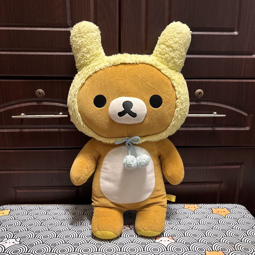 San-X Rilakkuma Warm Bunny (Category: Plushies & Soft Toys) located in Manila. Submitted by nero.ph (Listing ID 1467322834, Image 1). Description: - Authentic San-X Rilakkuma XL plush (Dated 2010) - Wears an adorable fuzzy yellow bunny hood with blue string ties and pom-poms - Features a functional zipper detail on the back - Super soft fabric with a white belly patch and round tail - In excellent, clean condition from a smoke-free home.