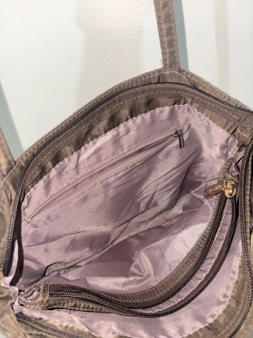 Secosana Brown Nylon Shoulder Bag Tote (Category: Shoulder Bags) located in Mandaluyong City. Submitted by riioooo (Listing ID 1467219775, Image 3). Description: - Brand: Secosana - Material: Lightweight brown nylon - Closure: Secure top zip - Straps: Dual shoulder straps - Use: Perfect spacious everyday bag.