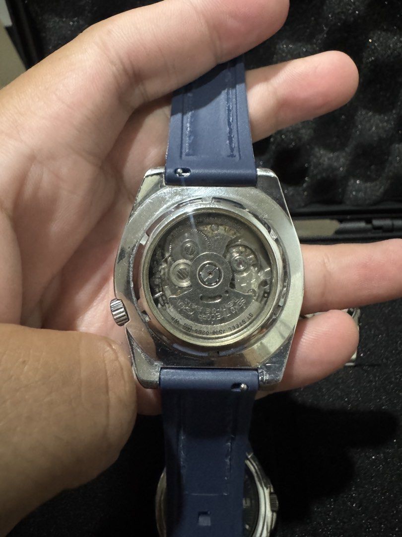 Seiko 5 Sports “Protos” Automatic Diver Watch “SNZD65” (Category: Men's Watches) located in Manila. Submitted by basilisk0816 (Listing ID 1467294041, Image 2). Description: - Brand/Model: Seiko 5 Sports Automatic Watch “Protos” rare white Dial - Dial: Textured silver dial with day and date display at 3 o'clock - Bezel: Rotating blue bezel with numbers - Movement: 23-jewels automatic movement with exhibition case back - Strap: Comfortable dark blu