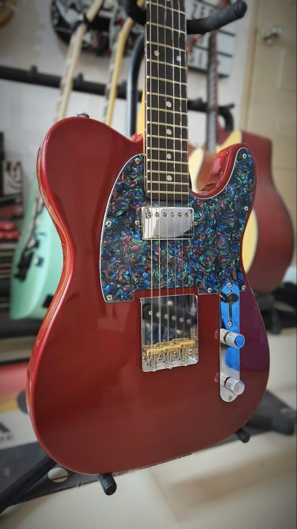 Severo Telecaster Complete Setup (Category: Musical Instruments) located in Manila. Submitted by bentaandco (Listing ID 1467342629, Image 3). Description: Severo telecaster 10k Complete set up New ernieball strings Pick up point cabuyao Specs: Body & Finish Body Type: Telecaster style Body Material: Poplar wood base with a Basswood veneer on the top and back Finish: Gloss Color: Maroon [1] Neck & Fingerboard Neck Material: Roasted Maple Neck Shap