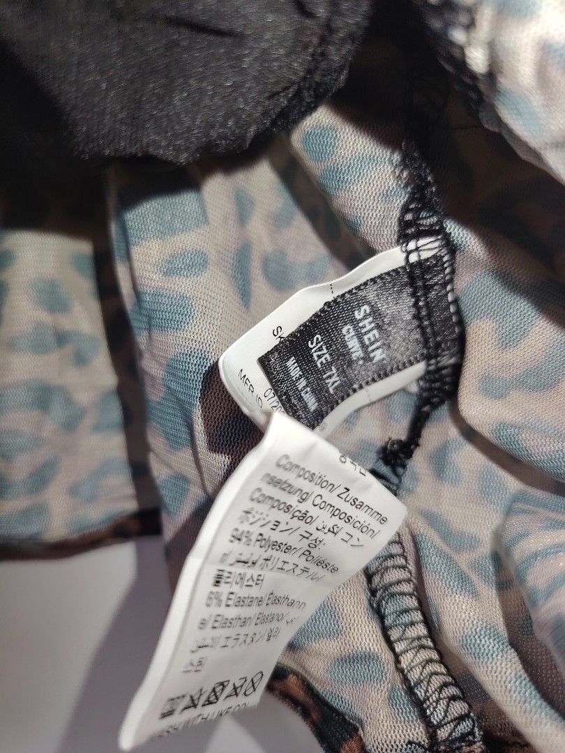 SHEIN BAE Plus Size Leopard Print Mesh Corset Top (Category: Sleeveless) located in Manila. Submitted by babeboxtheory (Listing ID 1467273350, Image 3). Description: - Brand: SHEIN BAE - Size: 7XL (Plus Size) - Design: Leopard print mesh fabric with elegant black lace trim - Structure: Built-in boning for support and shape - Closure & Straps: Hook-and-eye back closure with adjustable spaghetti straps - Material: 94% polyester, 6% elastane - Condi