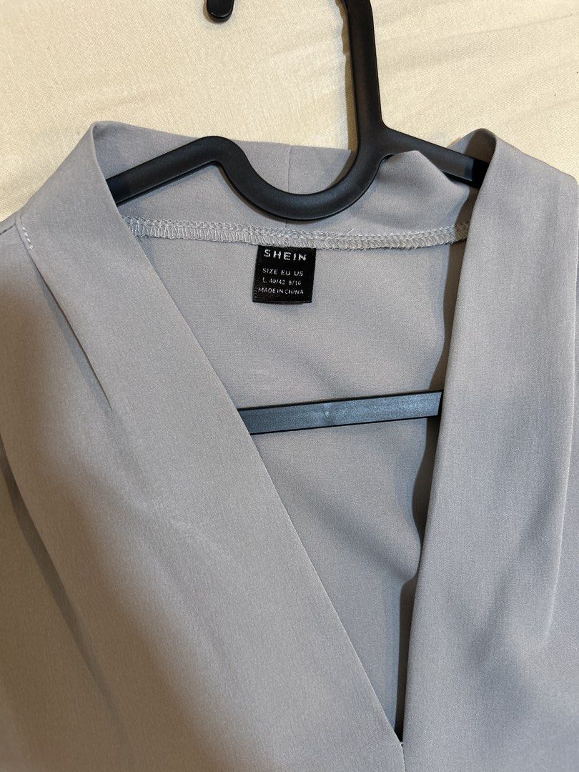 SHEIN Grey V-Neck Long Sleeve Blouse Size L (Category: Longsleeves) located in Quezon City. Submitted by kyokoaman (Listing ID 1467299721, Image 2). Description: - Brand/Item: SHEIN Grey Blouse - Size: L (EU 40/42, US 8/10) - Neckline & Details: V-neck with subtle front pleating - Sleeves: Long sleeves with buttoned cuffs - Material: Smooth, lightweight, and comfortable - Styling: Solid color, versatile for office or daily wear, easy to match wit