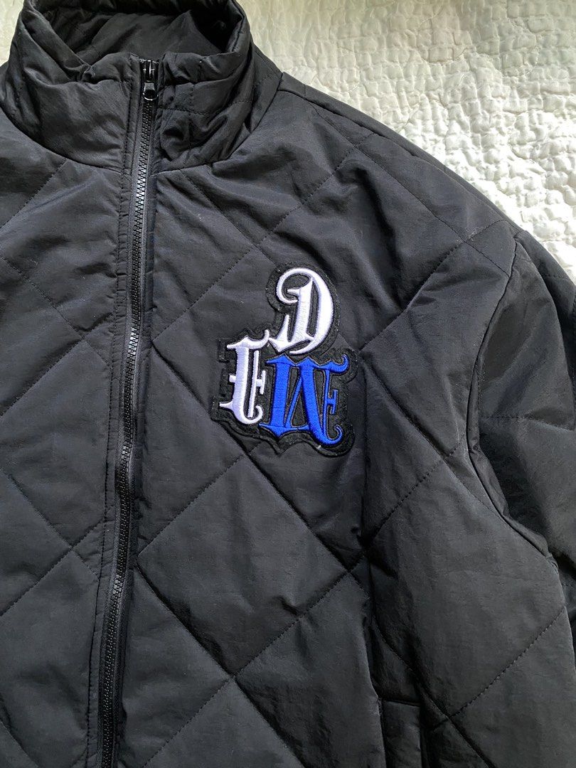 shootbrand black quilted zip up jacket (Category: Coats, Jackets and Outerwear) located in Iloilo. Submitted by chapxythriftshop (Listing ID 1467222279, Image 2). Description: - Brand/Model: Shootbrand quilted jacket - Color: Solid black - Size: Medium - Design: Diamond pattern stitching with embroidered chest patch (white and blue lettering) - Features: Mock neck, full zip front, soft fleece lining, elastic cuffs, and adjustable drawstring hem -