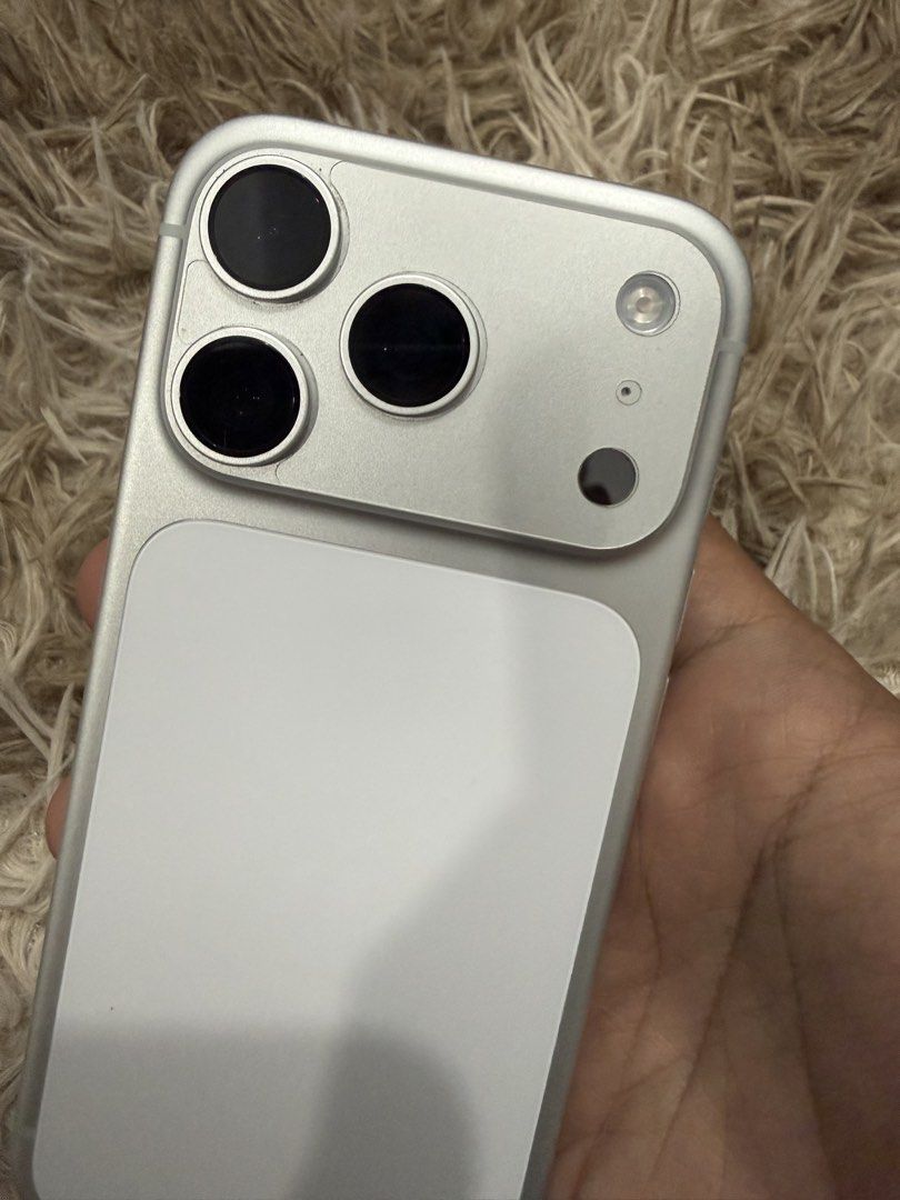 Silver Apple iPhone (Category: iPhone 17 Series) located in Caloocan City. Submitted by bouesantos06 (Listing ID 1467330138, Image 2). Description: iPhone 17 Pro 256gb Silver Factory Unlocked (Any Sim) Local Variant X/A 100% BH 30+ CC All working Unit, Case and Cord only ( No Box ) P57,999 Only For sale or Swap to your lOS Devices Pref: 16 Pro, pag usapan nalang additional cash North Caloocan area. Willing to meetup around SM Fairview / SM SJDM /