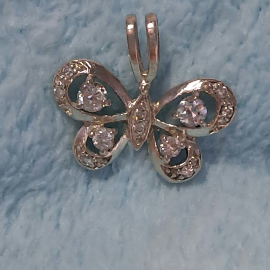 Silver Butterfly Pendant with Crystal Stones (Category: Necklaces) located in Pila. Submitted by ester_aurea (Listing ID 1467212534, Image 1). Description: Vintage Silver Butterfly Pendant imported gcash+sf no cod - Design: Gorgeous butterfly shape with detailed openwork wings - Stones: Encrusted with clear crystal stones and larger round center stones - Backing: Solid metal backing for durability - Bail: Built-in bail that fits most standard cha