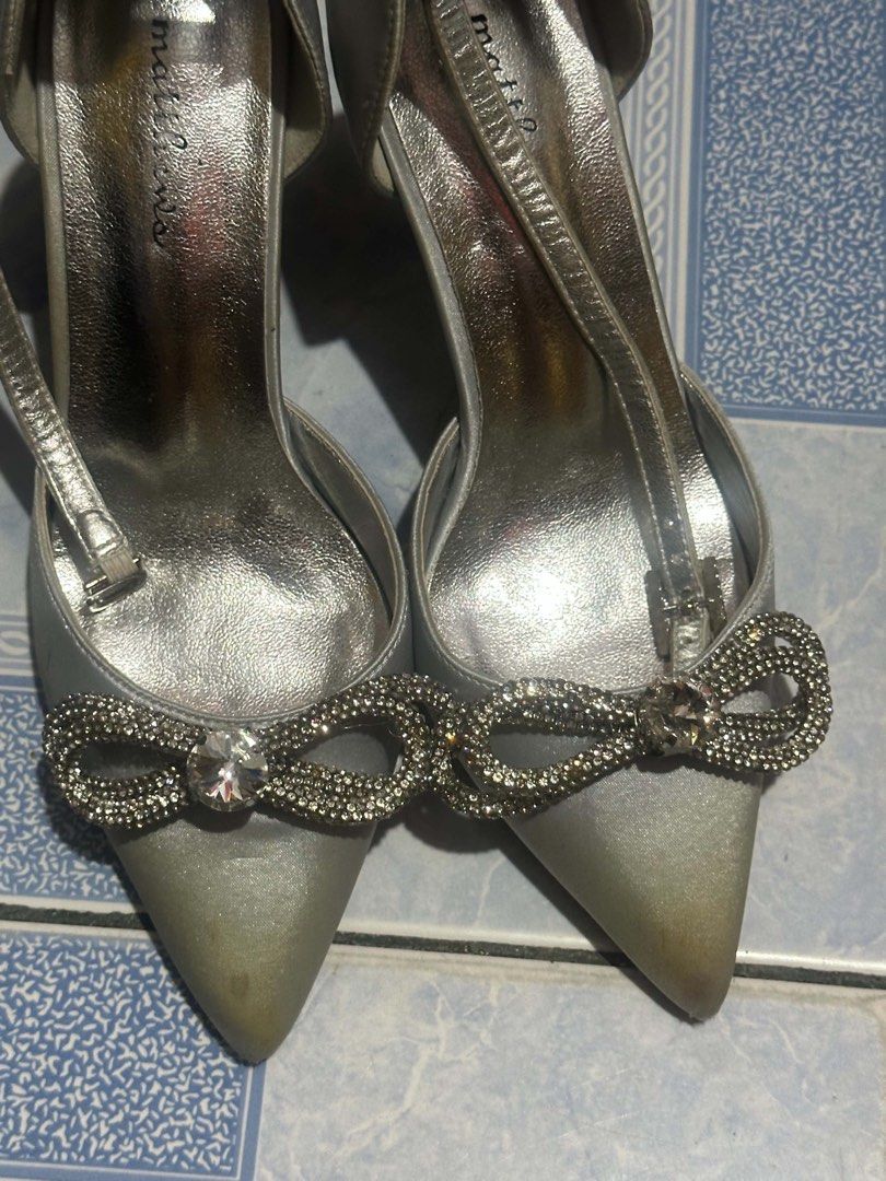 Silver Heels (Category: Heels) located in Manila. Submitted by diarchived (Listing ID 1467354001, Image 1). Description: Only used once (prom) na stuck nalang sa cabinet kaya ganyan color. Size: 36 Original Price: 2k.